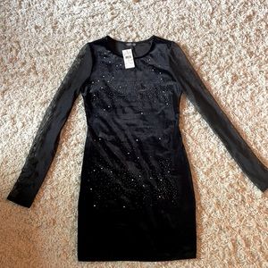 Black velour mini dress, with sheer sleeves.